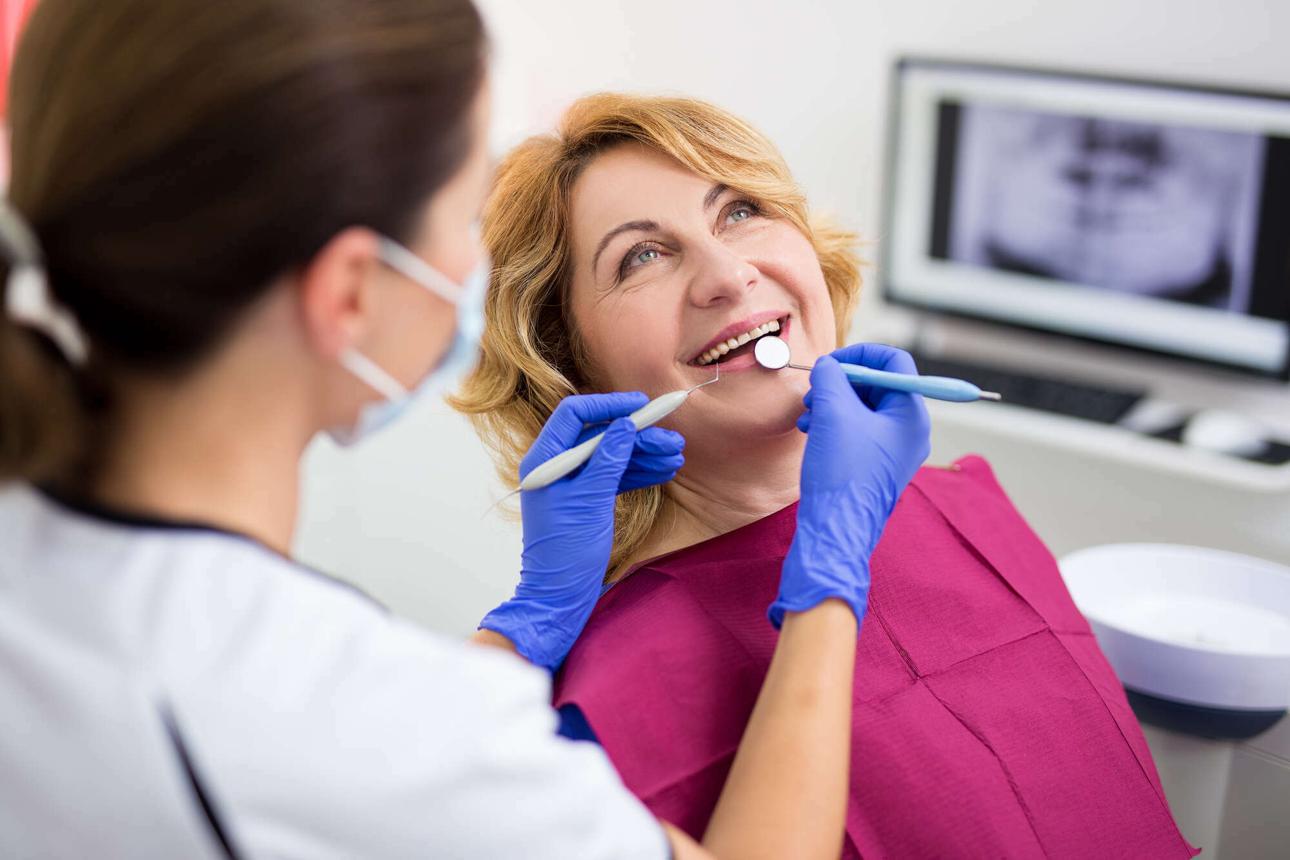 A smiling woman during a dental check-up