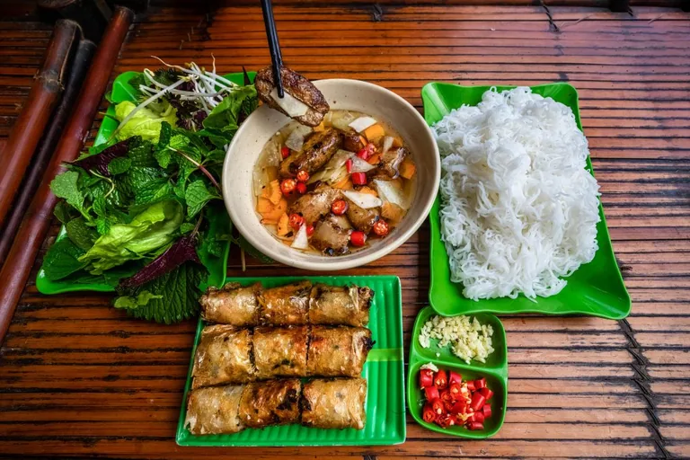 Bun cha with grilled pork, rice noodles and fresh herbs