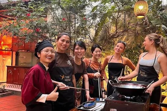 Blooming Passage guests cooking together with a local chef