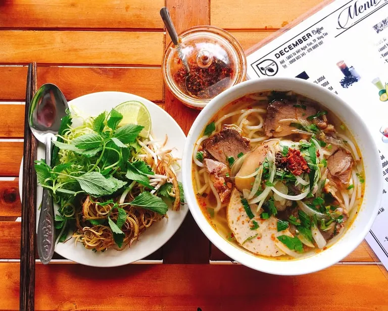 A bowl of bun bo Hue, the city’s famous spicy noodle soup