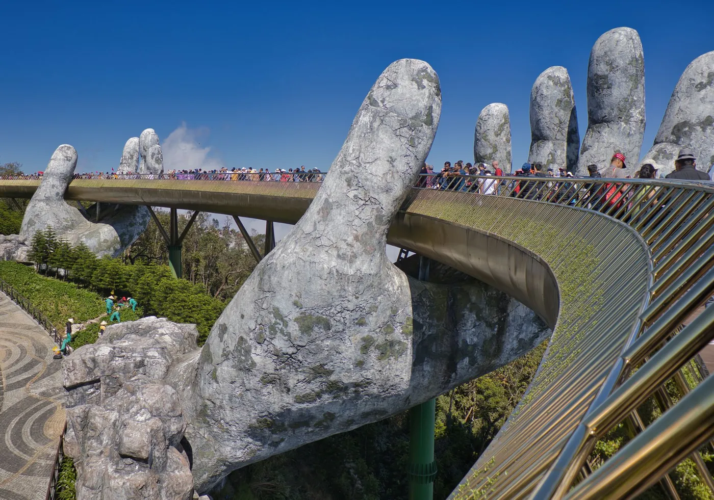Giant stone hands holding up the Golden Bridge