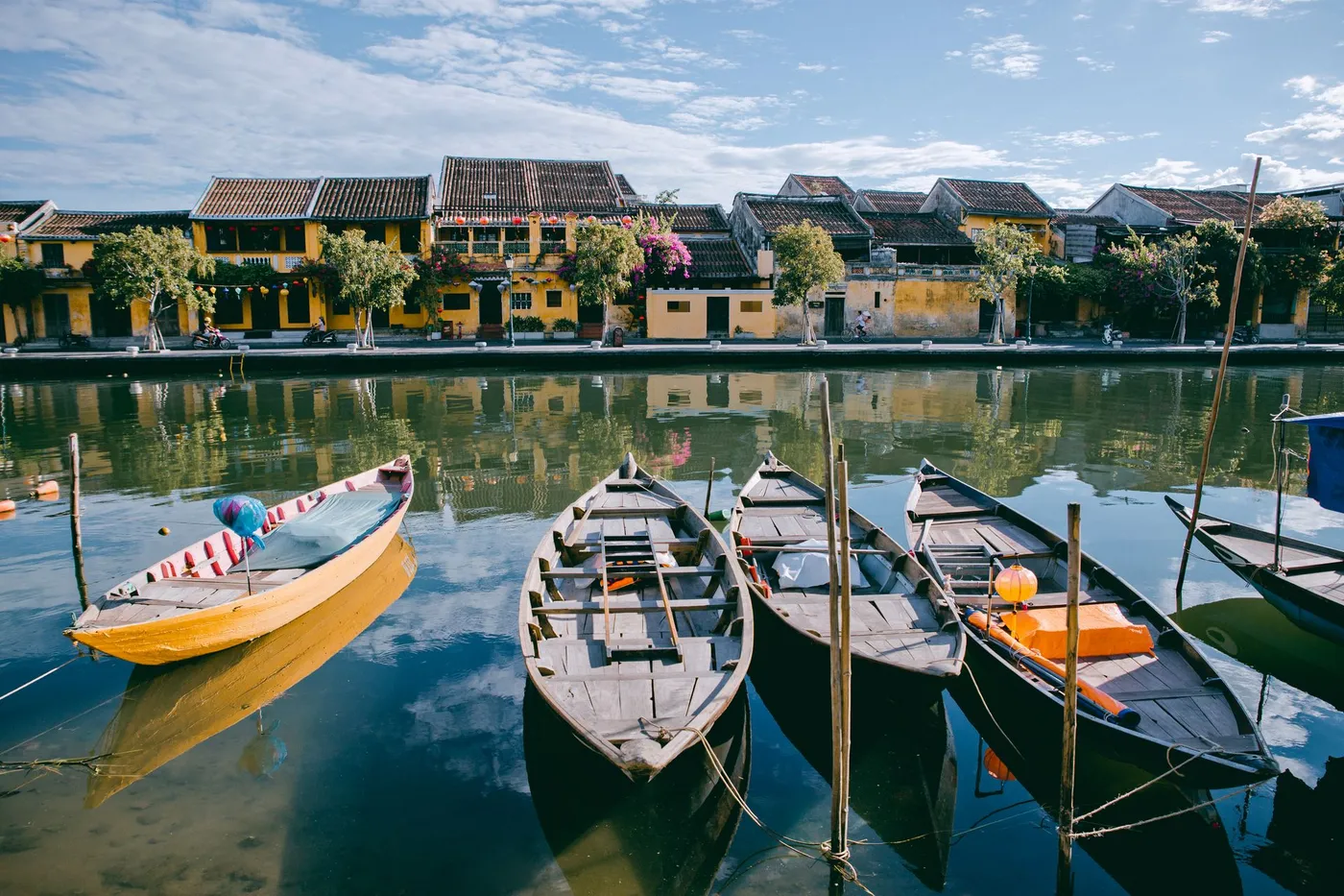 Wooden boats on the river in front of Hoi An Ancient Town